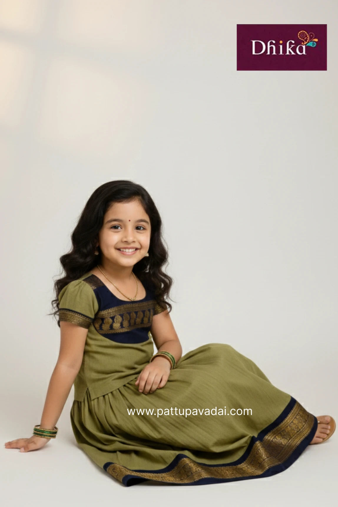 Young girl in a green traditional outfit with Dfiika branding on a white background