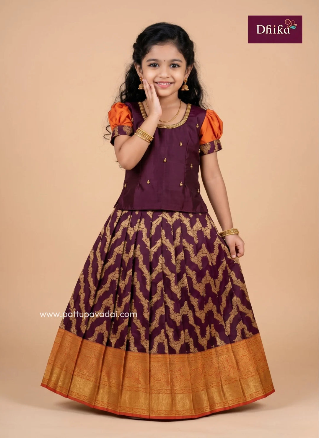 coffee brown and orange semi Kanchipuram pattu pavadai for girls with aari work