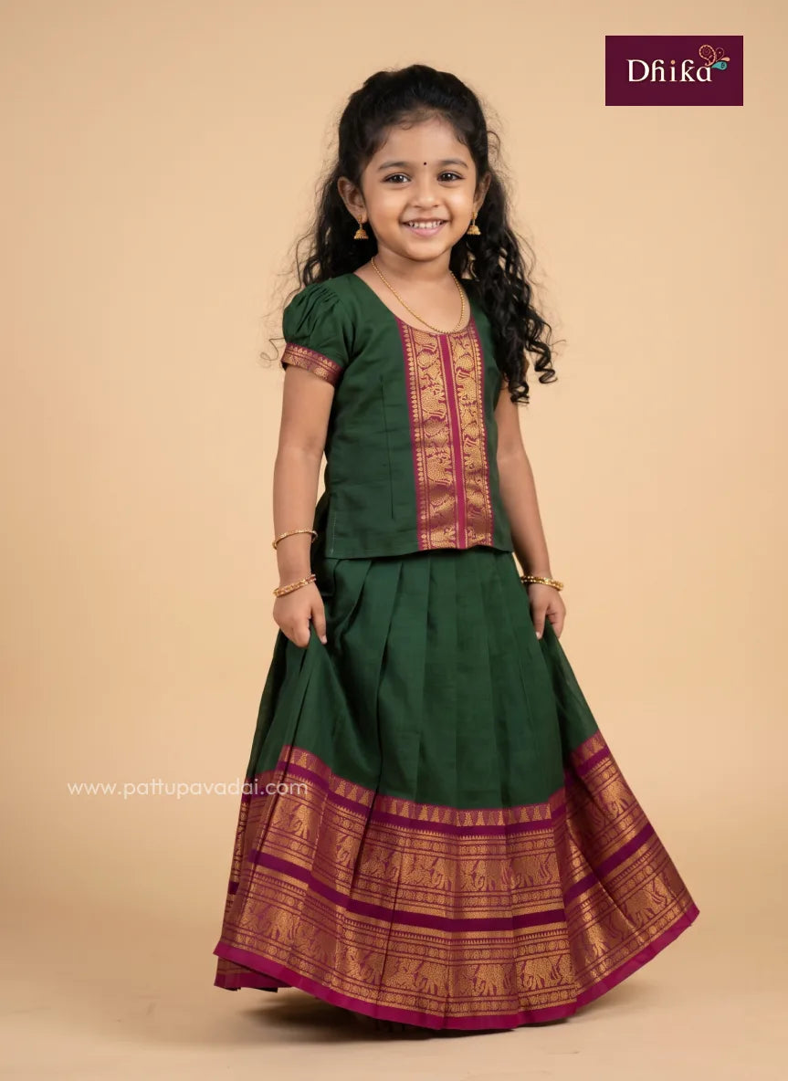 girls' traditional pavadai sattai in green and pink cotton