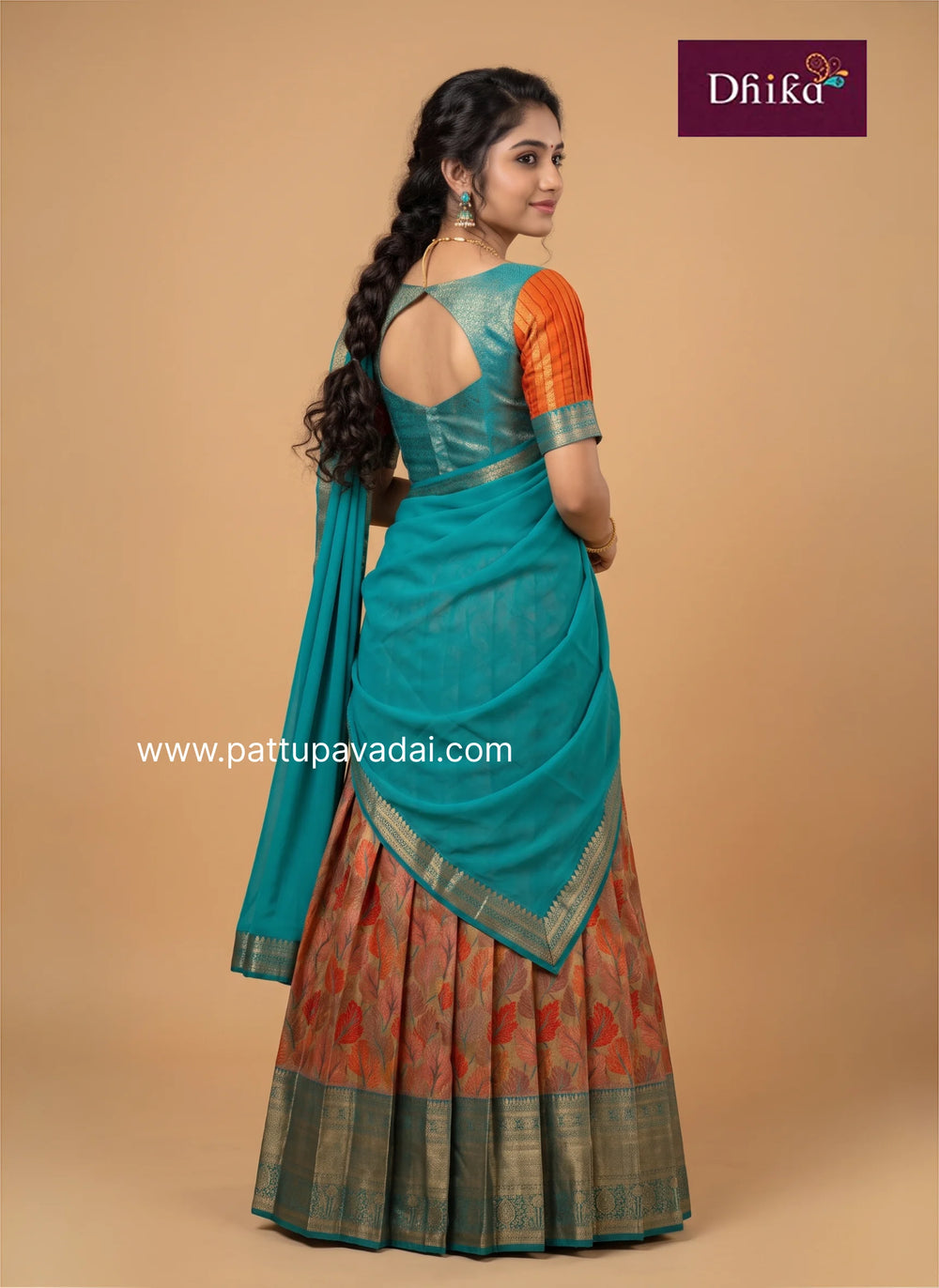 girls traditional red and bottle green pavadai in semi kanchi silk