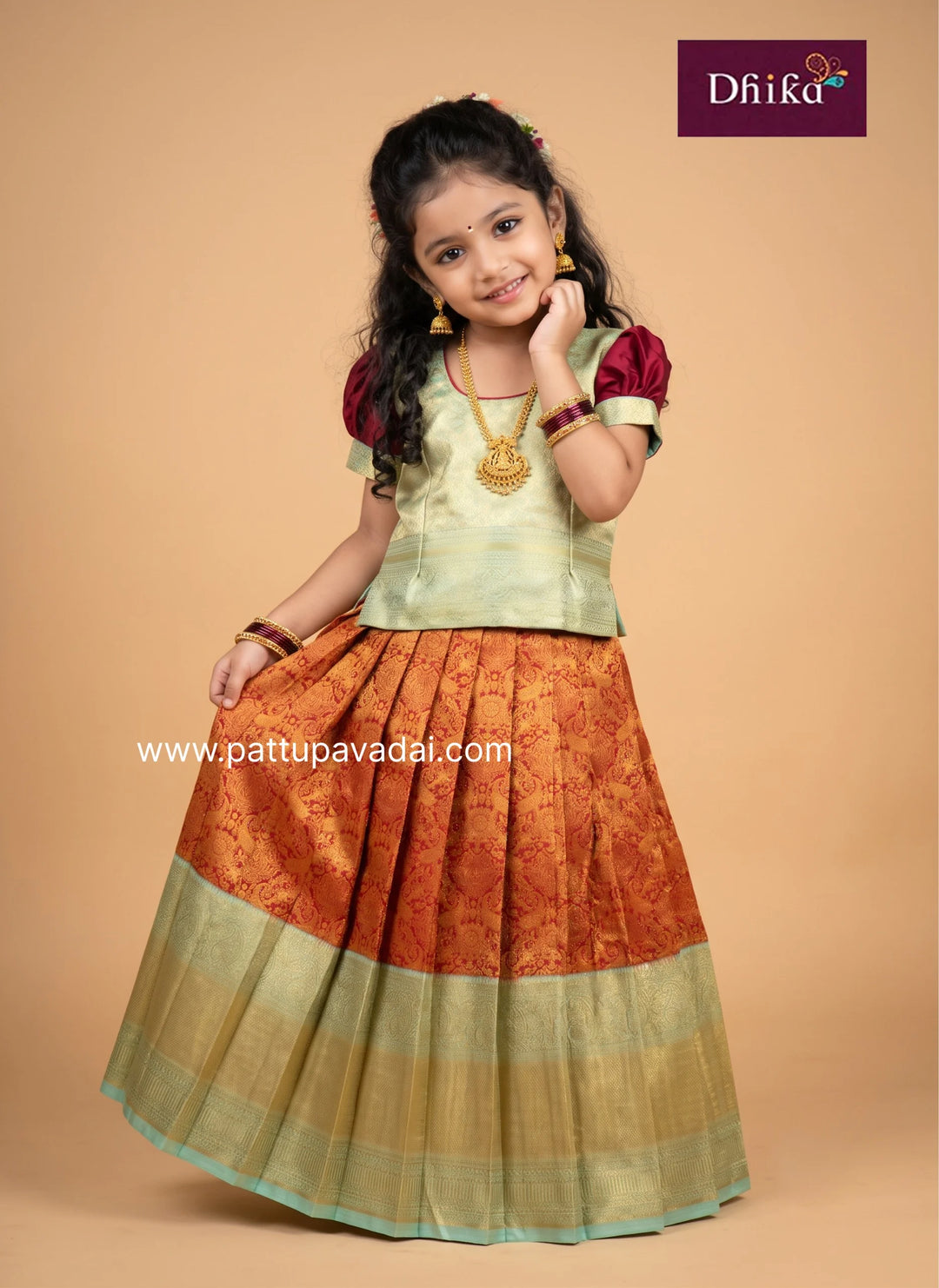 girls' traditional pattu pavadai in red and pista green