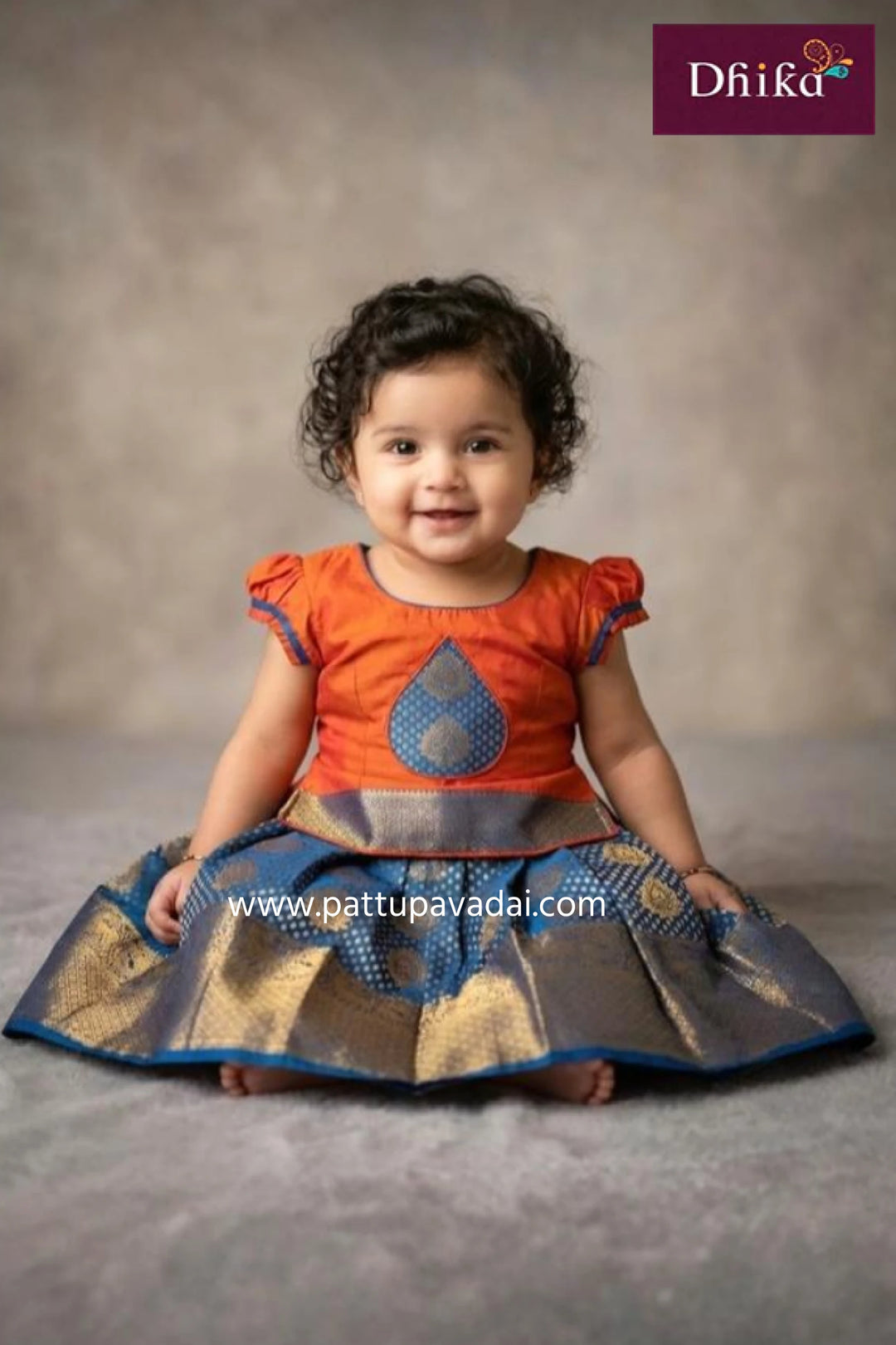 kids blue and orange silk pavadai flared skirt set with tassel work