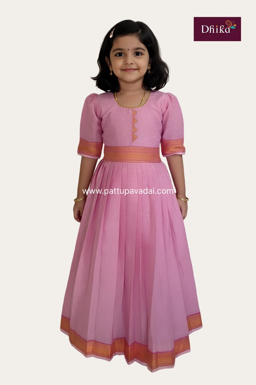 Young girl wearing a pink traditional outfit with orange accents on a white background, featuring the Drika brand.