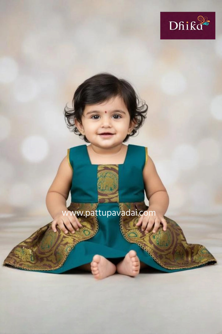 new born dark green silk frock with elephant and peacock designs sleeveless pattu frock for babies