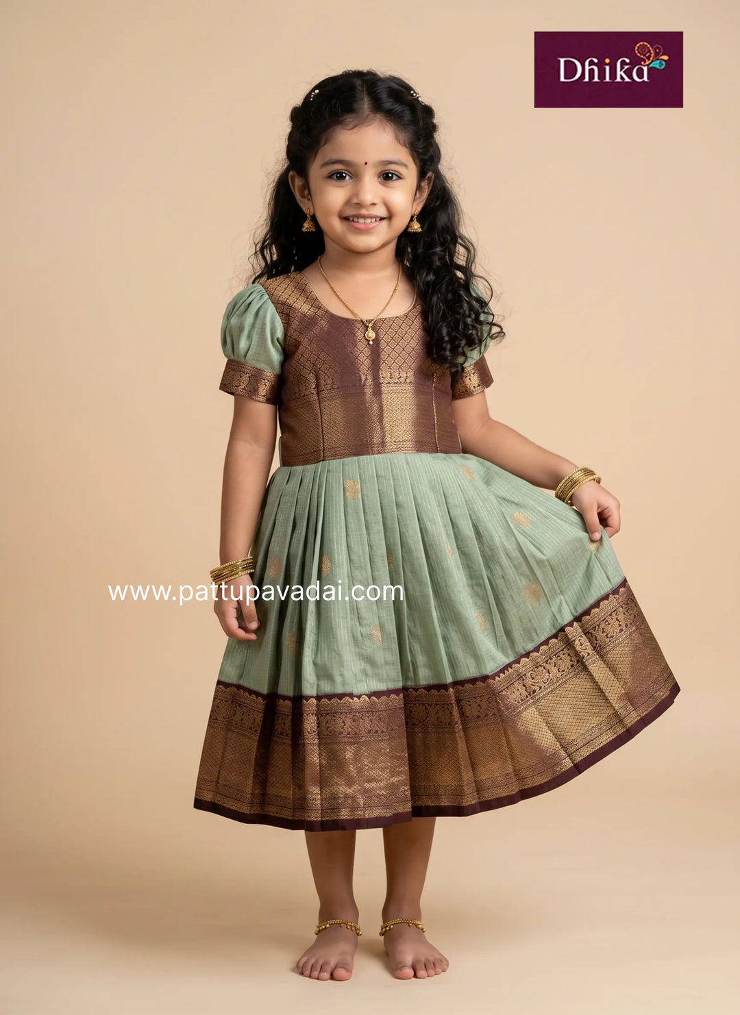 pastel green semi kanchipuram frock with brown detailing for kids