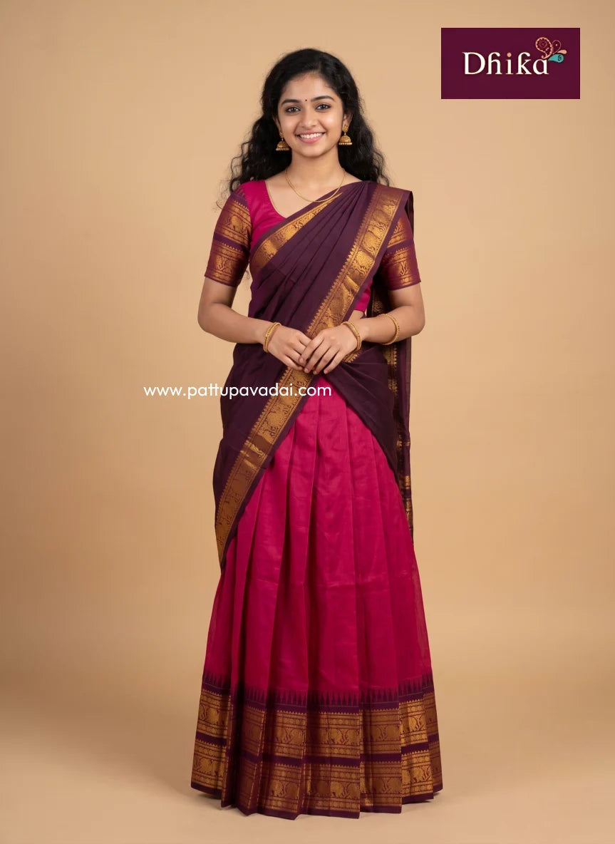 Girls wearing a pink and brown Chettinad cotton half saree