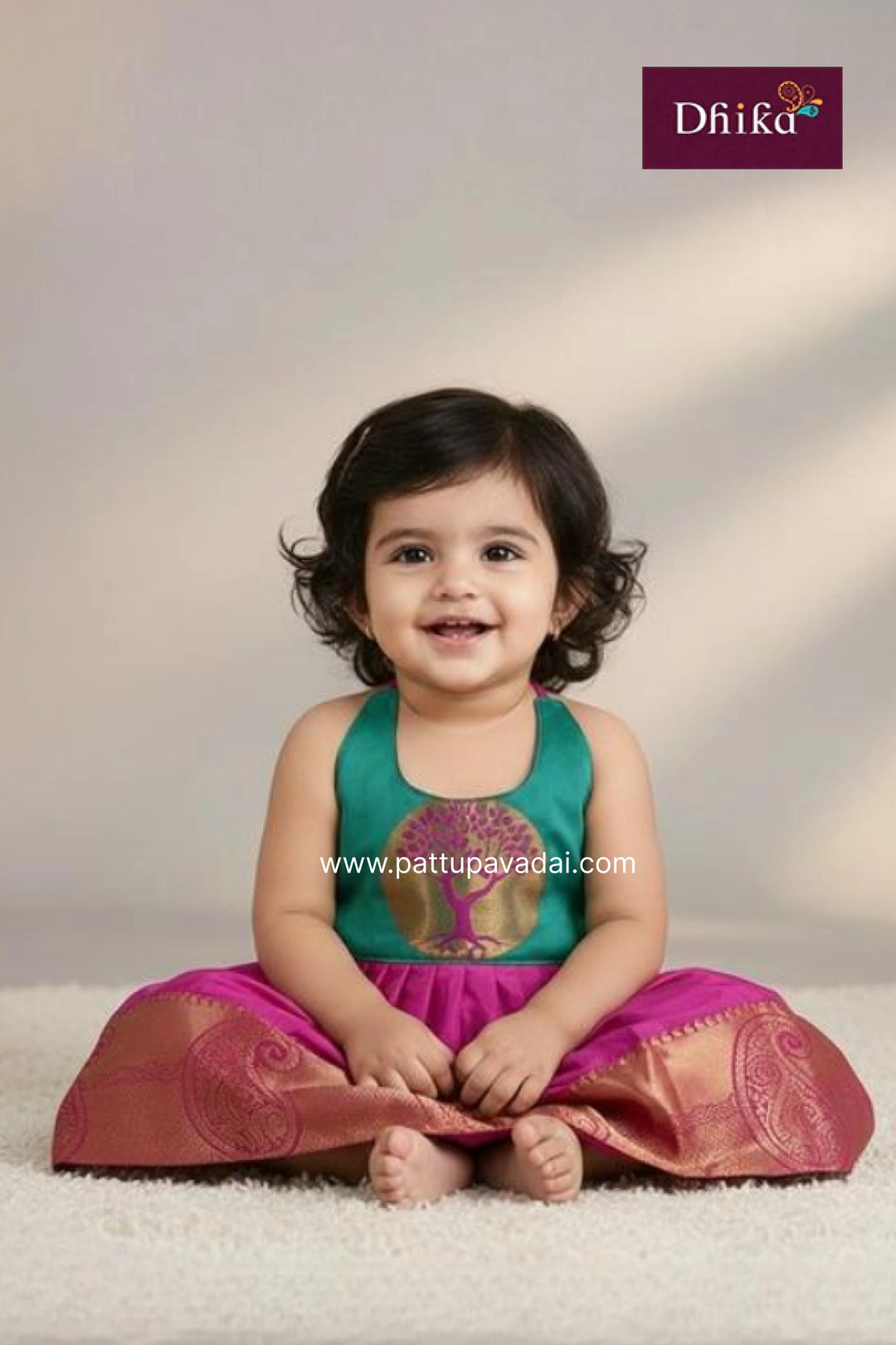 Child wearing a traditional outfit with a visible brand logo on a plain background