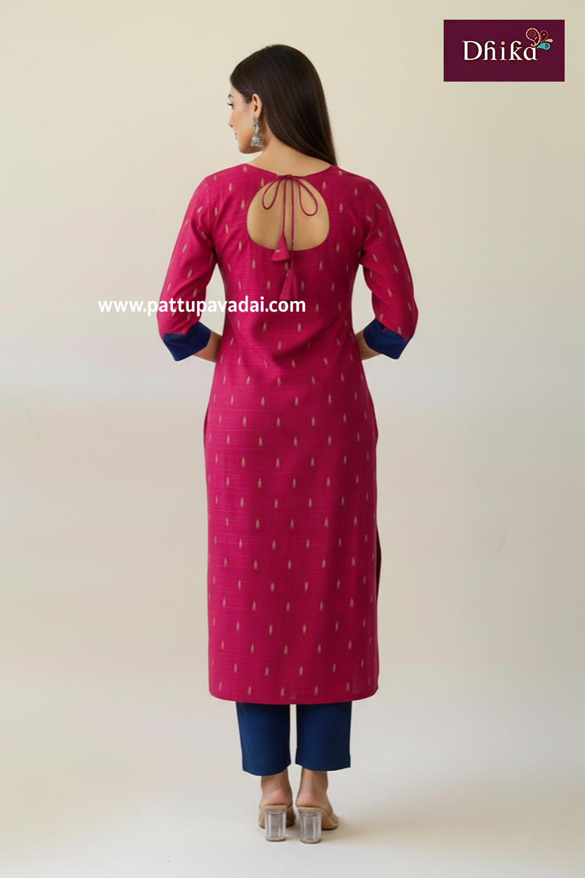 Woman wearing a pink kurta with blue pants on a white background, branded 'Dhika'.