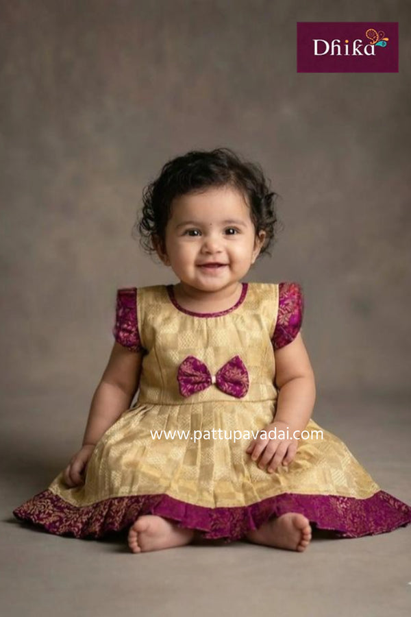 raw silk checked cream and magenta kids festive traditional frock with zari border and cotton lining from pattupavadai.com