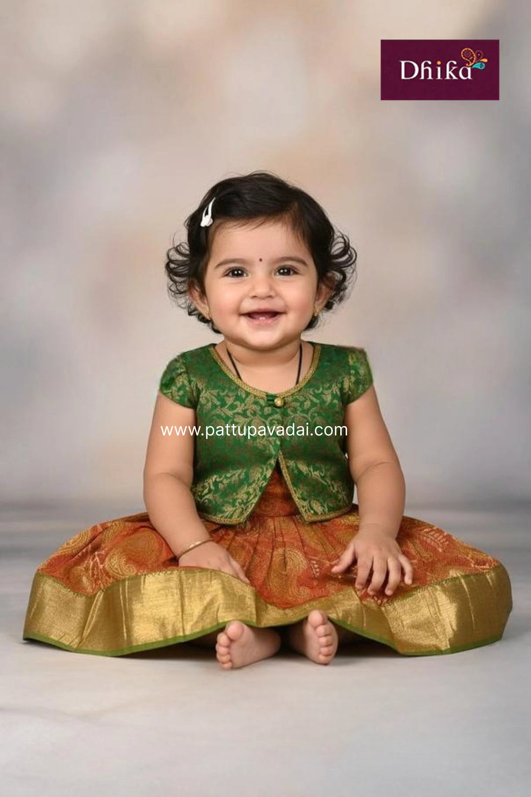 Child wearing a traditional outfit with a brand logo in the corner