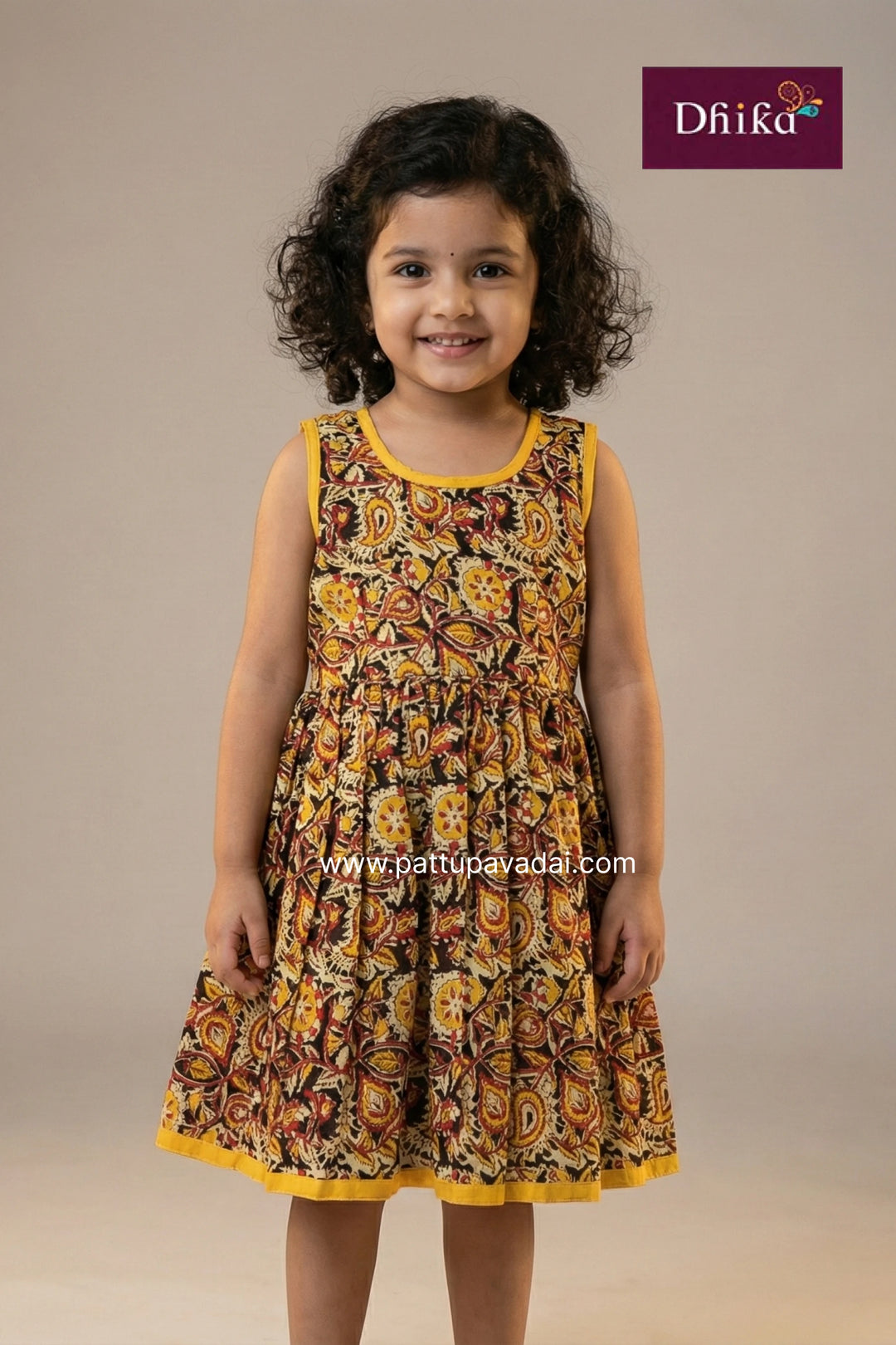 Young girl wearing a patterned dress with a beige background