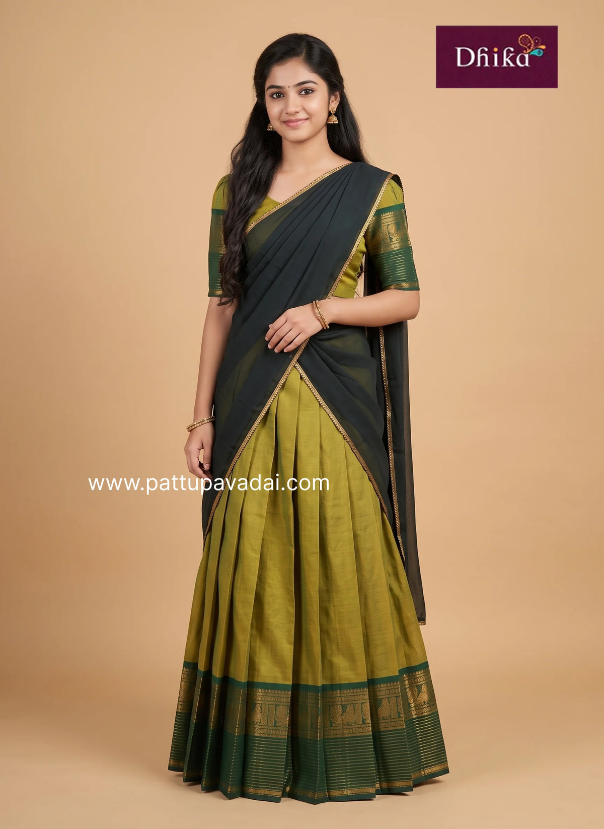 girl wearing chettinad cotton leaf green half saree front view traditional pavadai davani