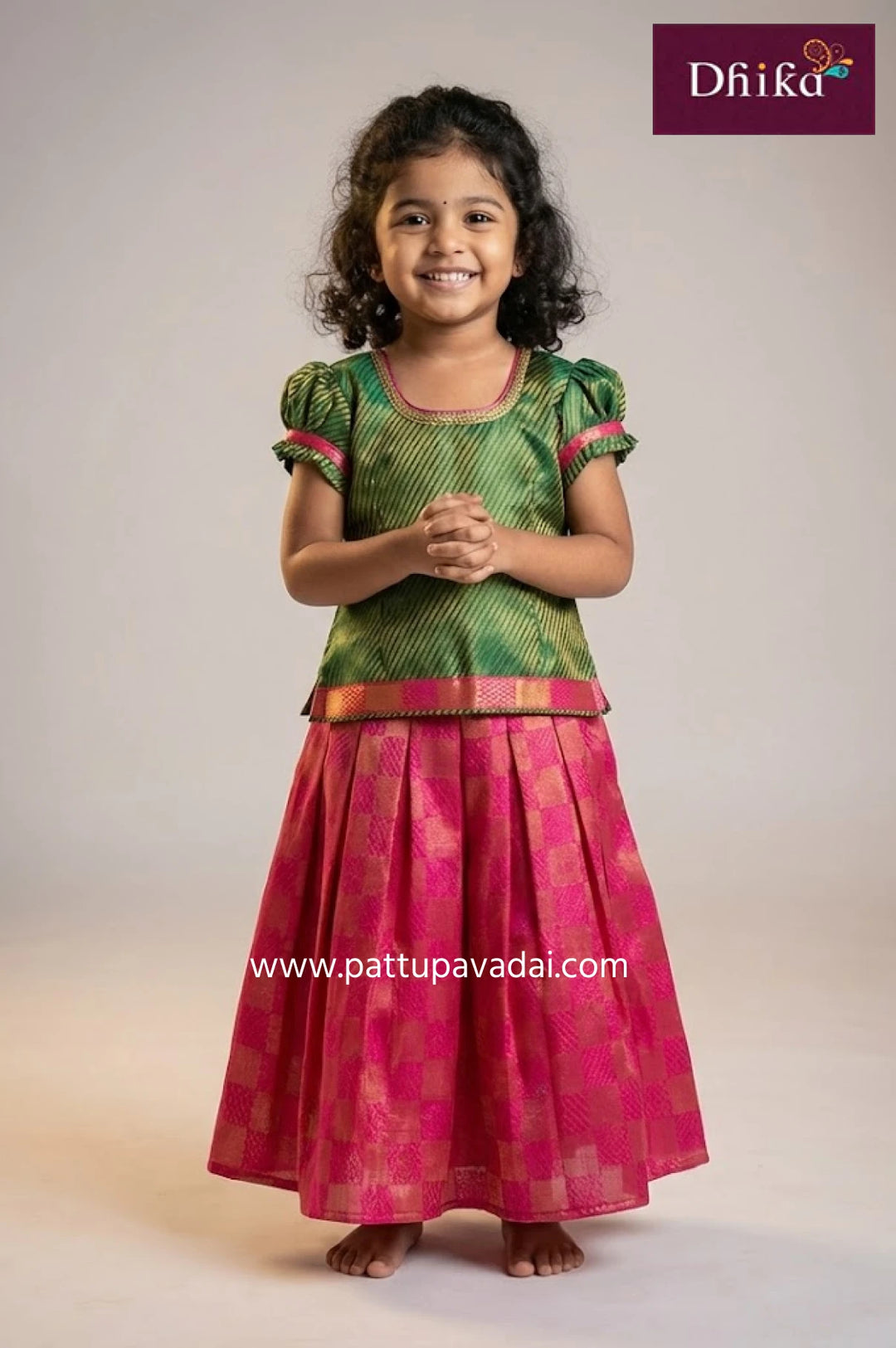 green and pink brocade pattu pavadai for kids with box pattern skirt puff sleeve blouse and cotton lining