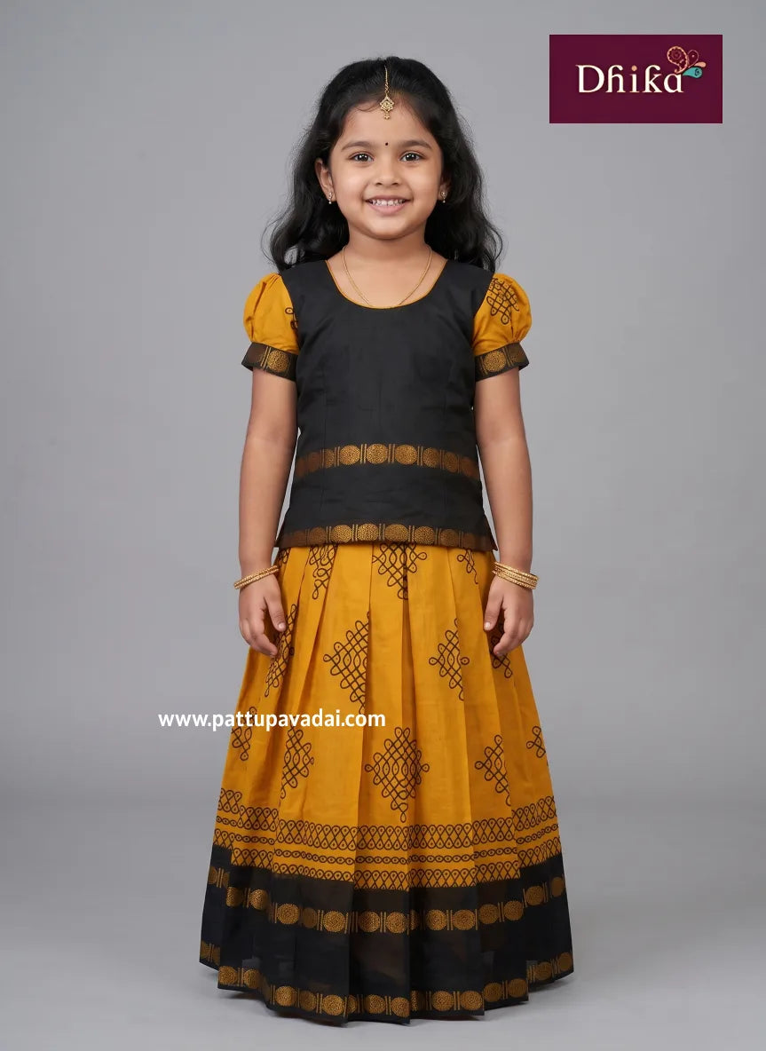 mustard and black cotton pavadai for girls traditional wear