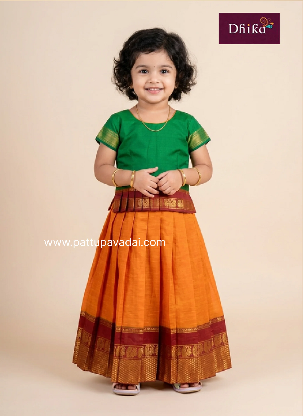 orange and green cotton pattu pavadai for girls traditional dress